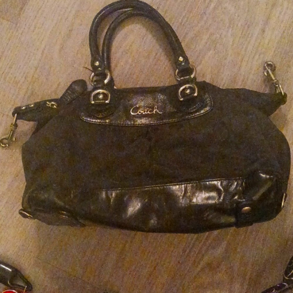 Black Coach purse approximately 14 in Long about 8 in deep,
